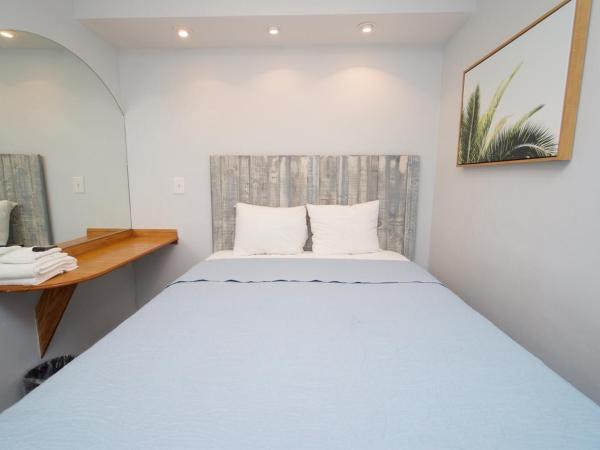 Ocean Lodge Santa Monica Beach Hotel : photo 6 de la chambre suite chambre lit king-size avec 2 lits