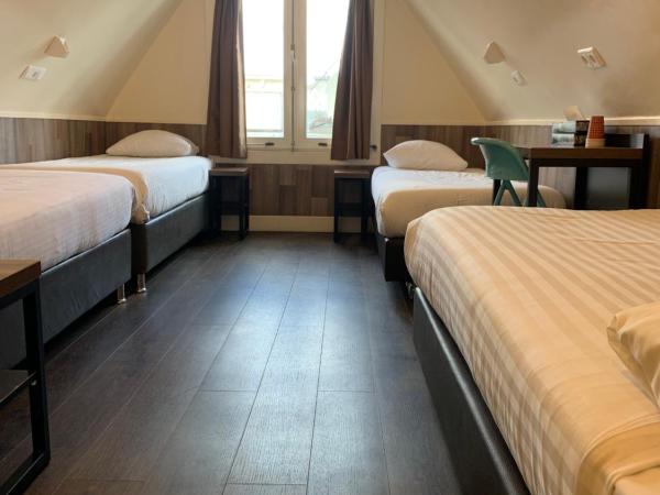 Orange Tulip Hotel : photo 2 de la chambre chambre quadruple basique mansardée avec salle de bains privative