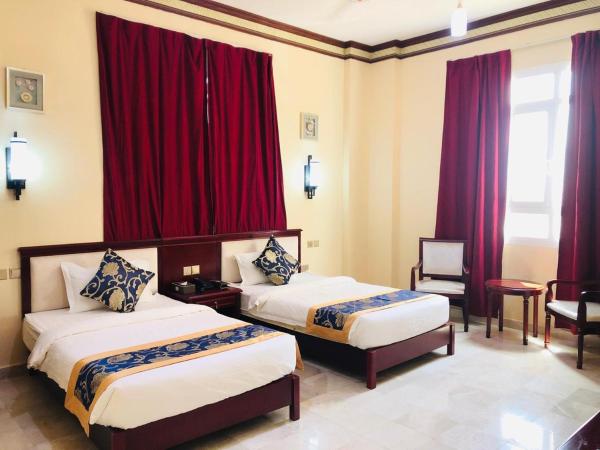 Farah Hotel Apartment : photo 1 de la chambre chambre lits jumeaux standard