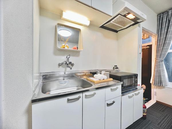 attomi hostel : photo 2 de la chambre chambre quadruple avec salle de bains