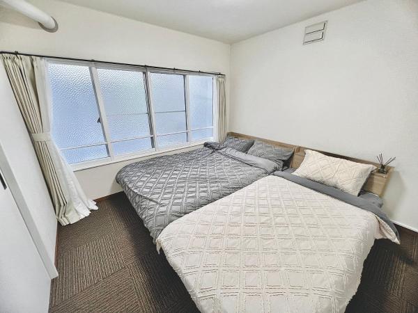 attomi hostel : photo 6 de la chambre chambre quadruple avec salle de bains