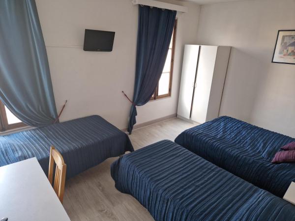 Hôtel du Commerce : photo 1 de la chambre chambre familiale