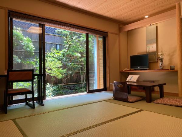 Ryokan Sawaya Honten : photo 1 de la chambre chambre lits jumeaux supérieure - vue sur jardin