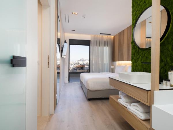 LUX&EASY Athens Metro Suites : photo 1 de la chambre suite maisonnette 1 chambre avec jacuzzi