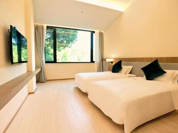 无锡花园大酒店 : photo 3 de la chambre chambre lits jumeaux supérieure - vue sur jardin
