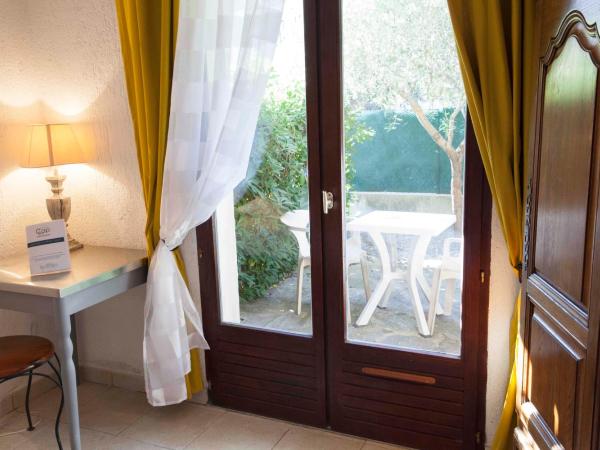 Motel Cap Sol : photo 10 de la chambre chambre double ou lits jumeaux classique avec vue sur le jardin