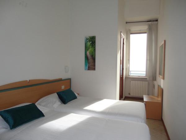 Hotel Sacro Cuore : photo 2 de la chambre chambre lits jumeaux - vue sur jardin