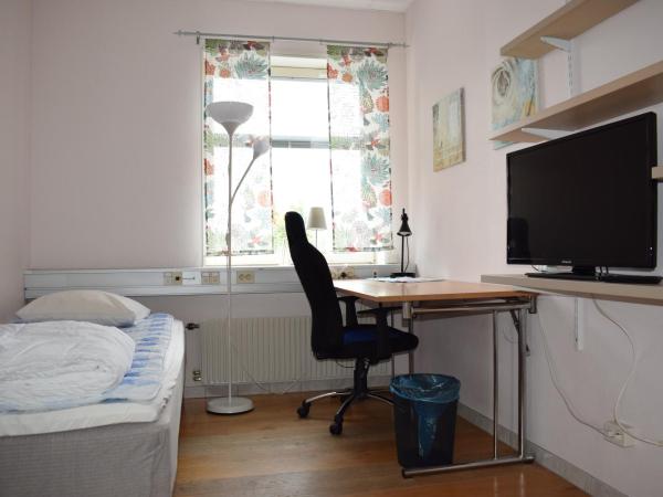 Vallabiten Rum och Lägenheter : photo 1 de la chambre chambre simple avec toilettes et douche communes