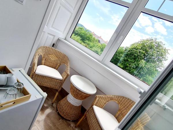 Penzion Valkoun-Lilienfeld : photo 7 de la chambre chambre triple - vue sur jardin