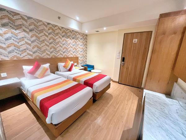 The Orion Plaza - Nehru Place : photo 8 de la chambre chambre deluxe double ou lits jumeaux