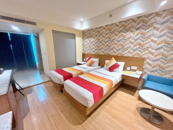 The Orion Plaza - Nehru Place : photo 4 de la chambre chambre deluxe double ou lits jumeaux