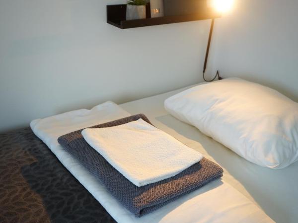 Inn Tourist Hostel : photo 4 de la chambre chambre simple Économique avec salle de bains commune