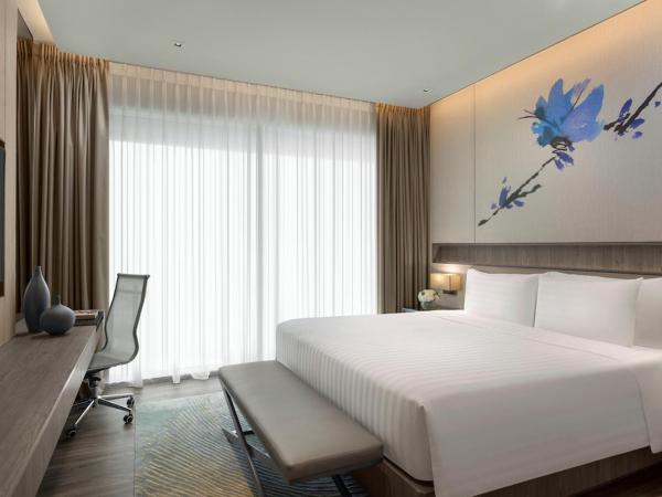 Dusit Thani Laguna Singapore : photo 1 de la chambre hébergement lit king-size exécutif dusit - côté ville