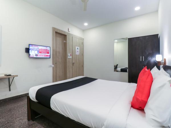 Capital O GN Suites : photo 3 de la chambre chambre double standard