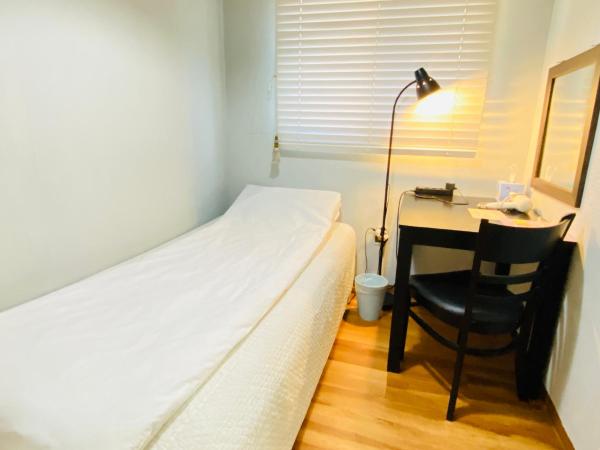 Aroha Guesthouse Seoul Station : photo 4 de la chambre chambre simple avec salle de bains commune