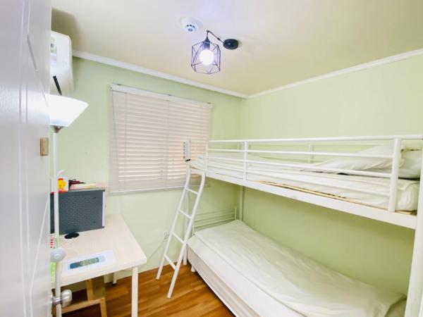 Aroha Guesthouse Seoul Station : photo 5 de la chambre chambre lits jumeaux