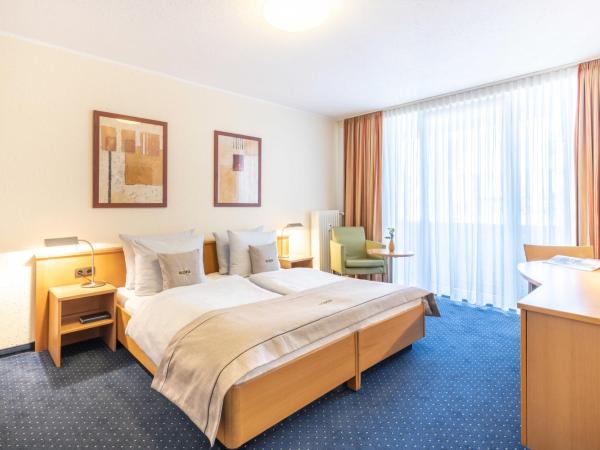 acora Bonn Living the City : photo 1 de la chambre chambre lits jumeaux standard