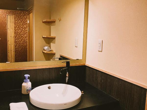 Ryokan Sawaya Honten : photo 9 de la chambre chambre lits jumeaux supérieure - vue sur jardin