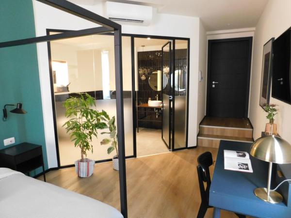 Piumaviola Beds & Apartments : photo 4 de la chambre suite avec jacuzzi