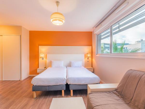 Appart'City Confort Montpellier Ovalie I : photo 1 de la chambre studio familial supérieur avec lits jumeaux