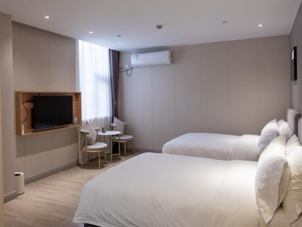 Shanghai JOYFUL YARD Hotel-Free shuttle bus from Pudong Airport and Disneylan : photo 5 de la chambre chambre familiale
