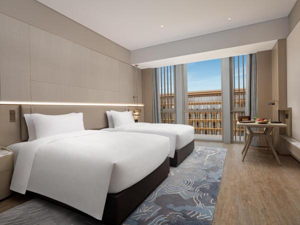 Wonderland Hotel Ningbo International Conference Center : photo 1 de la chambre superior twin room with garden view