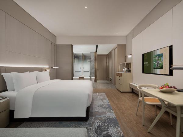 Wonderland Hotel Ningbo International Conference Center : photo 4 de la chambre deluxe king room with garden view