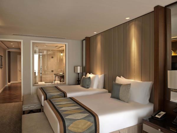 Taj Dubai : photo 2 de la chambre chambre familiale lits jumeaux - vue sur ville