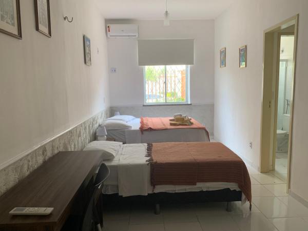Casa do Sol Fortaleza : photo 2 de la chambre chambre triple avec salle de bains privative