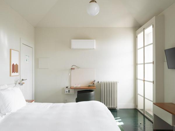 Duas Portas Townhouse : photo 4 de la chambre chambre double deluxe - vue sur mer