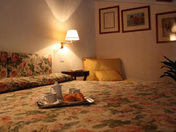 Hotel Santa Caterina : photo 1 de la chambre chambre triple