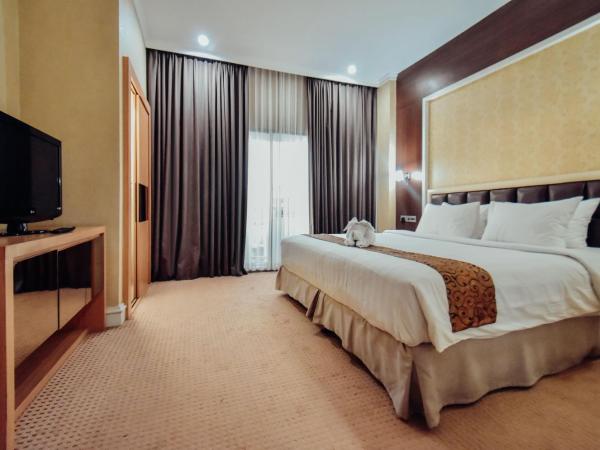 Surabaya Suites Hotel Powered by Archipelago : photo 1 de la chambre chambre de luxe luxueuse