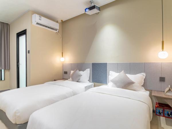 Puzzle Hotel Guangzhou Fenghuang New Village Subway Station : photo 1 de la chambre chambre double deluxe