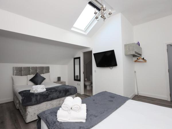 Hotel Anfield : photo 1 de la chambre chambre quadruple avec salle de bains privative