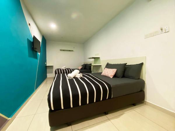 Hotel 91 Taman Daya : photo 3 de la chambre chambre double familiale