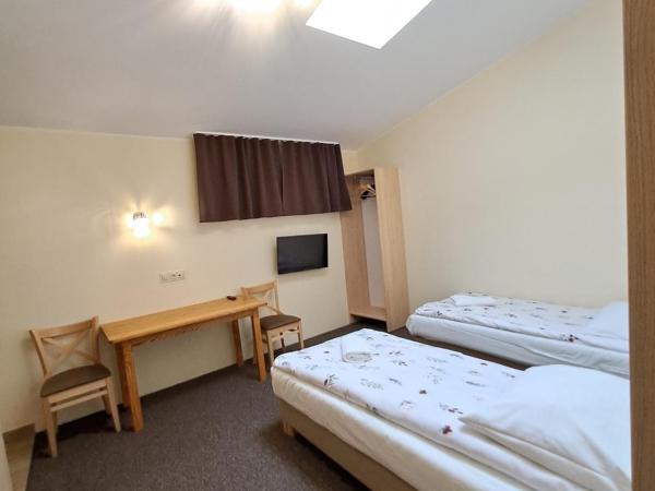 Dworek staropolski : photo 9 de la chambre chambre lits jumeaux spacieuse