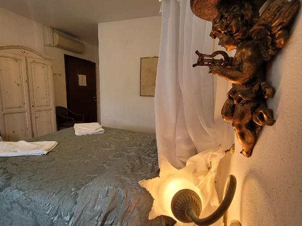 Cà Isabella : photo 7 de la chambre chambre lit king-size - vue sur mer