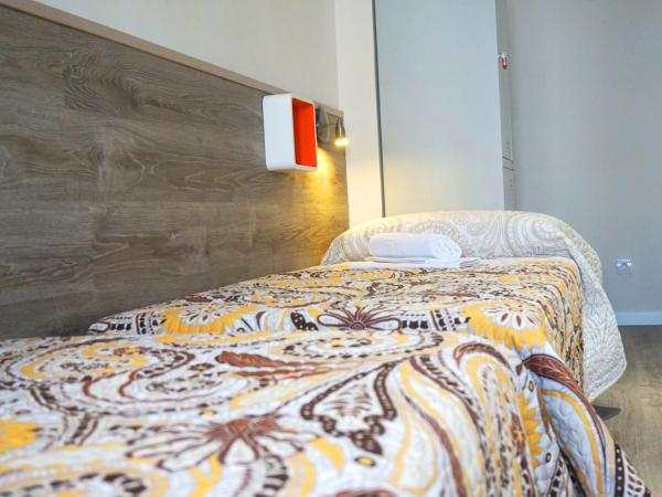 MuchoMadrid : photo 2 de la chambre  lit dans dortoir mixte de 4 lits avec salle de bains commune