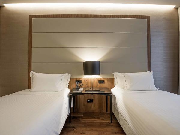 BessaHotel Liberdade : photo 1 de la chambre chambre double ou lits jumeaux avec lit d'appoint