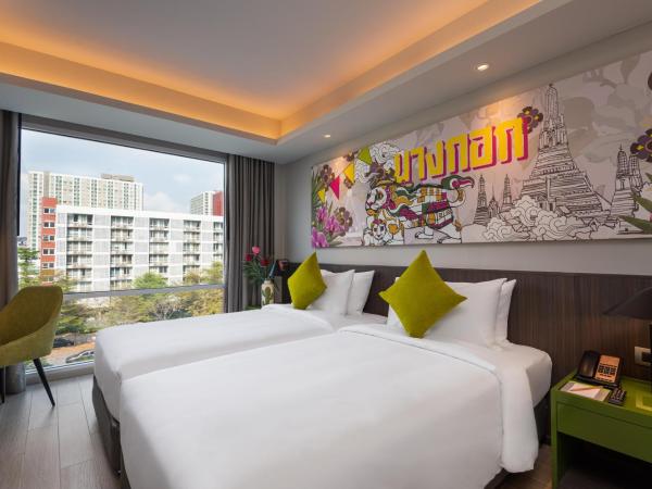 Maitria Hotel Rama 9 Bangkok - A Chatrium Collection : photo 7 de la chambre hébergement triple supérieur – vue sur jardin