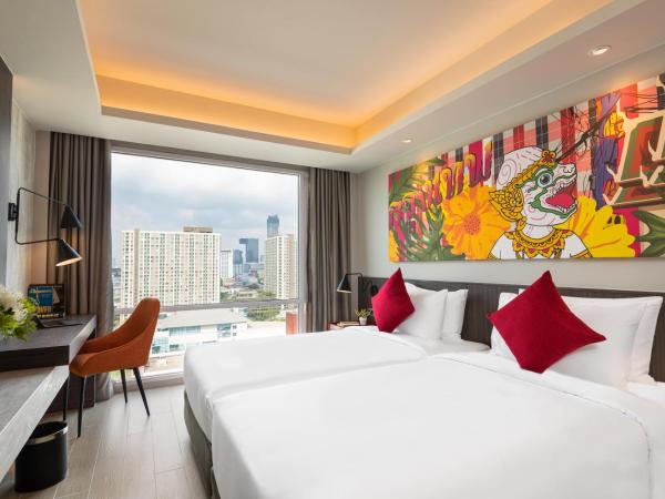 Maitria Hotel Rama 9 Bangkok - A Chatrium Collection : photo 5 de la chambre hébergement triple premier - vue sur jardin