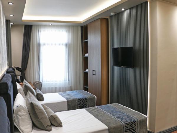 GRAND ÜSKÜDAR OTEL : photo 1 de la chambre chambre triple standard