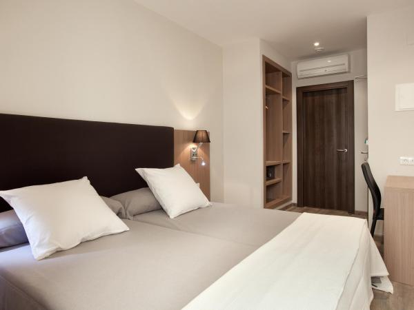 Hostal Centric : photo 8 de la chambre chambre lits jumeaux