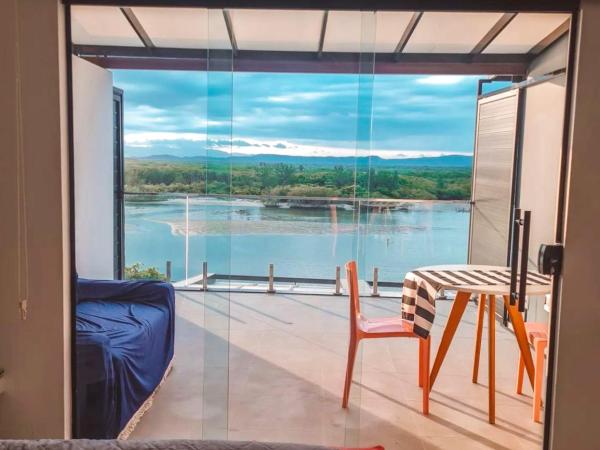 Suítes Luxo Marambaia- Epic House : photo 4 de la chambre chambre triple - vue sur mer