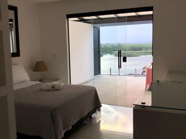 Suítes Luxo Marambaia- Epic House : photo 7 de la chambre chambre triple - vue sur mer