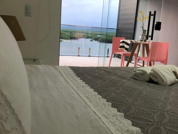 Suítes Luxo Marambaia- Epic House : photo 10 de la chambre chambre triple - vue sur mer