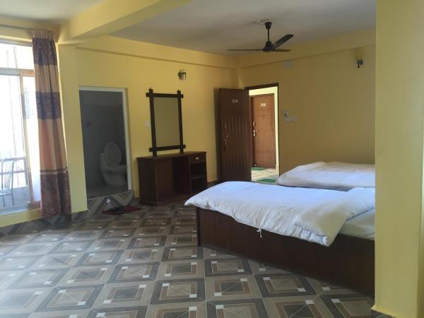 Hello Inn Guest House & Apartment : photo 1 de la chambre chambre deluxe double ou lits jumeaux