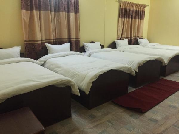 Hello Inn Guest House & Apartment : photo 2 de la chambre lit dans dortoir pour hommes de 4 lits