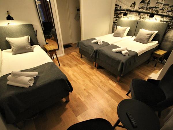 Vattengrändens Vandrarhem & Hotel : photo 1 de la chambre chambre triple avec toilettes communes