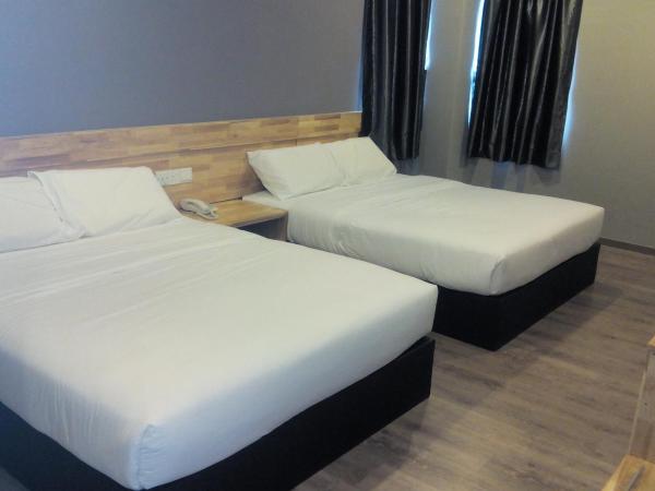 Hotel Suria 18 : photo 1 de la chambre chambre quadruple standard